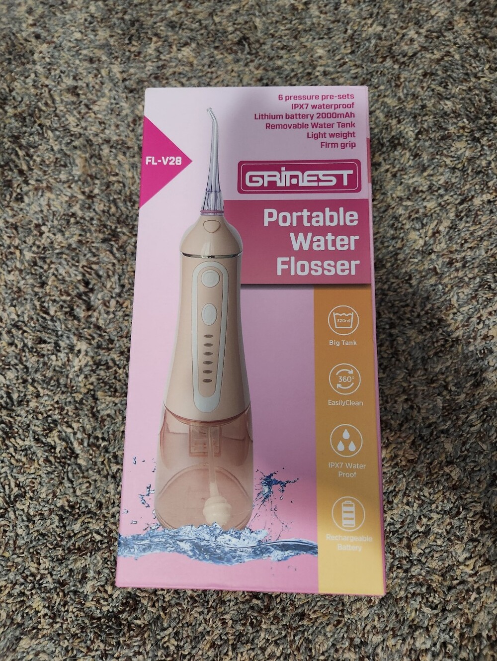 GRINEST Portable Water Flosser in Rose Gold and Pink